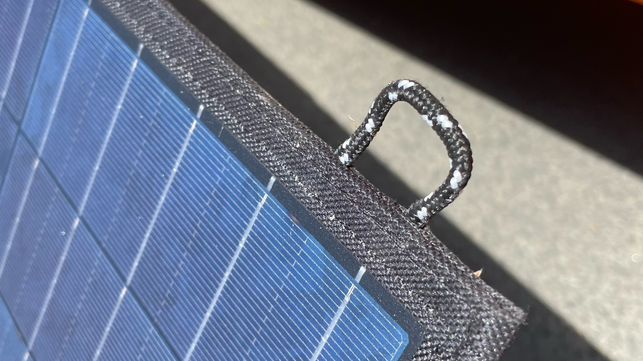 The nylon hooks mean yo can hang or tie down the Allpowers Solar Panel